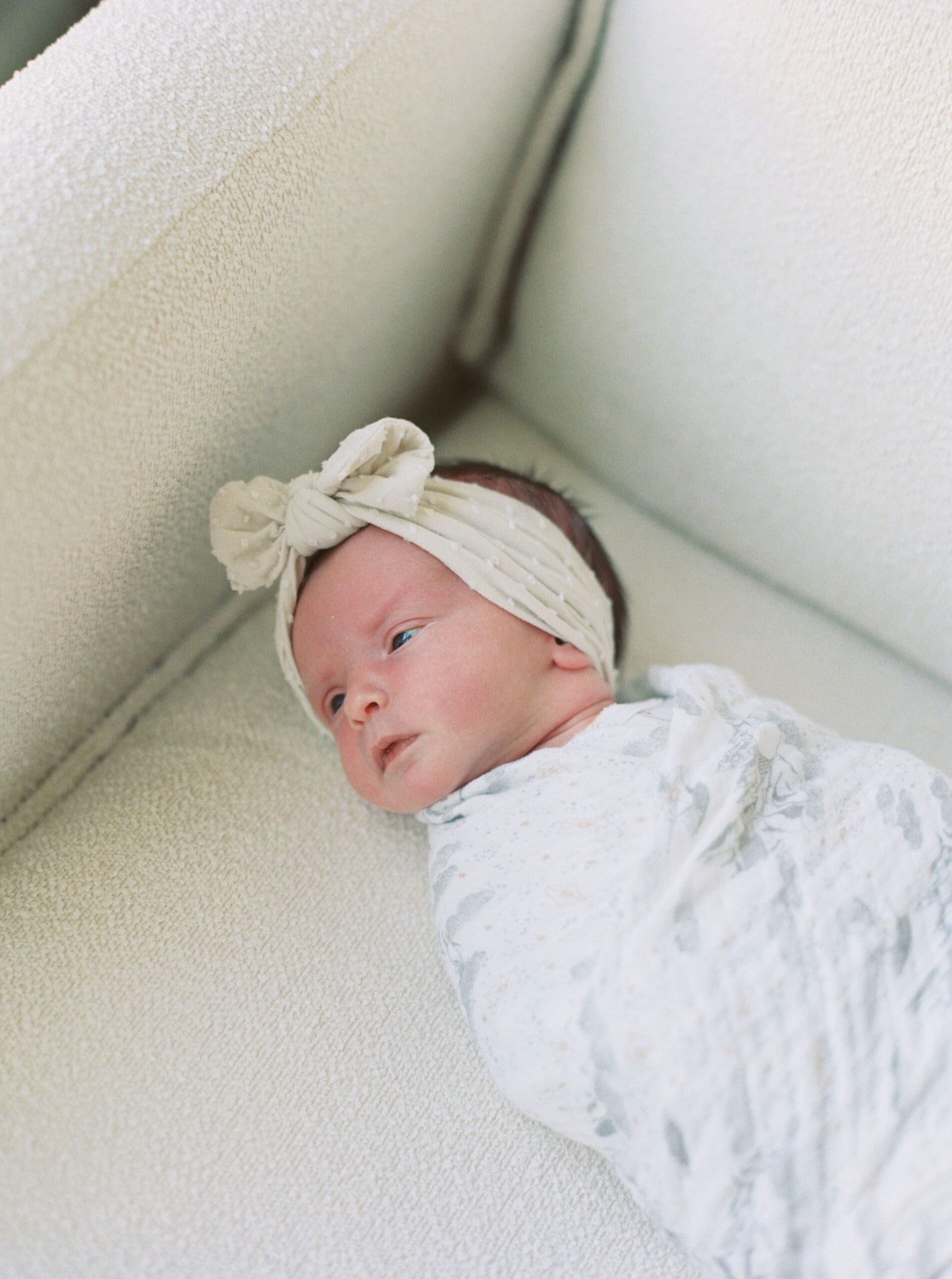 newborn baby on chair