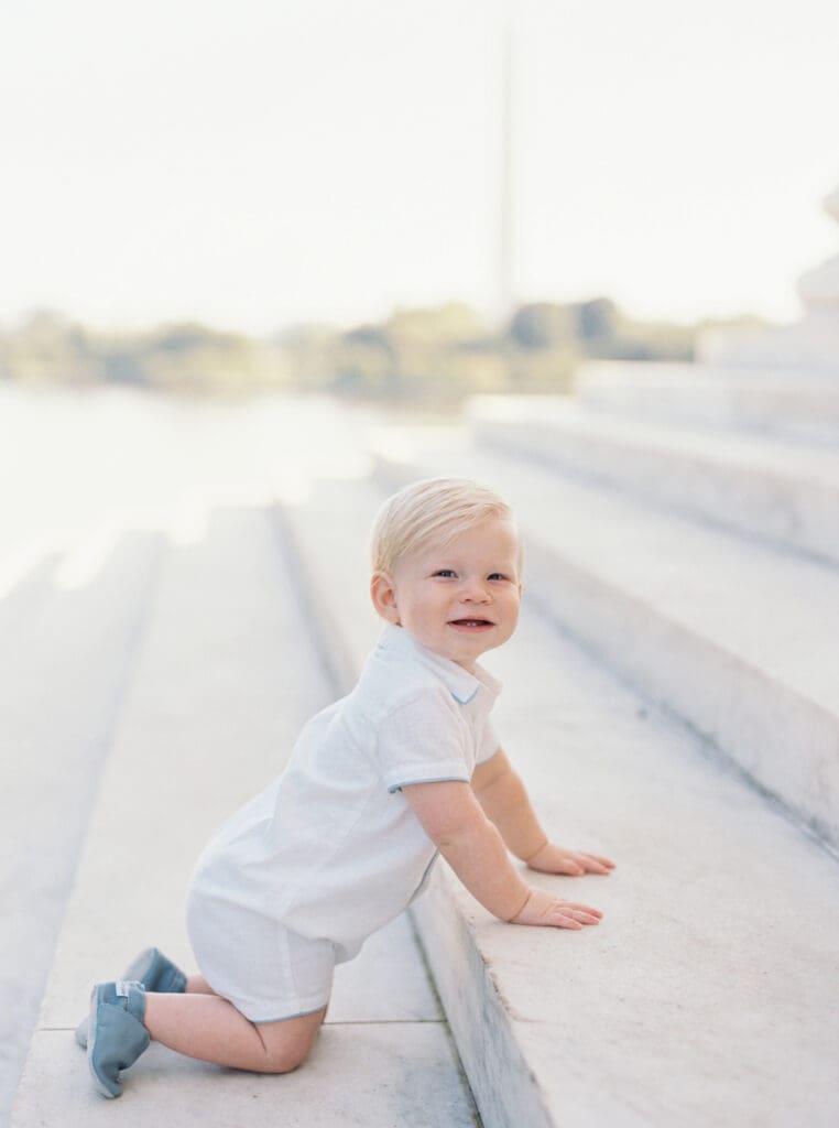 Family milestone session at the Jefferson Memorial in Washington DC — parents celebrating baby’s first birthday with iconic monument views, captured by luxury maternity & newborn photographer Washington DC area.