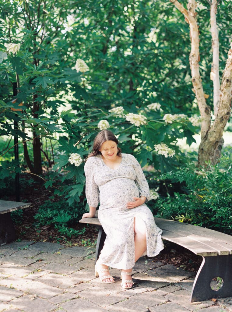 Maternity session at Brookside Gardens — expecting mother walking hand in hand with her husband, captured by luxury maternity & newborn photographer Washington DC area.