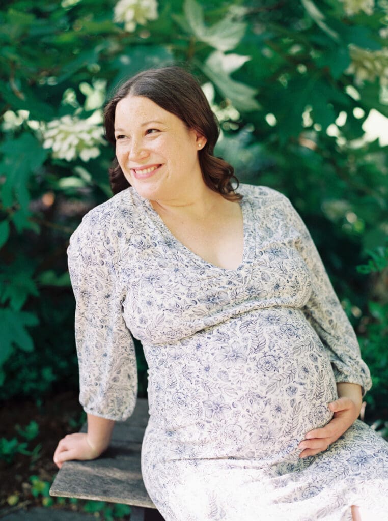 Maternity session at Brookside Gardens — expecting mother walking hand in hand with her husband, captured by luxury maternity & newborn photographer Washington DC area.