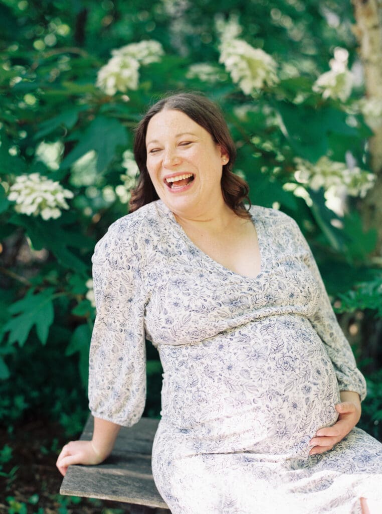 Maternity session at Brookside Gardens — expecting mother walking hand in hand with her husband, captured by luxury maternity & newborn photographer Washington DC area.