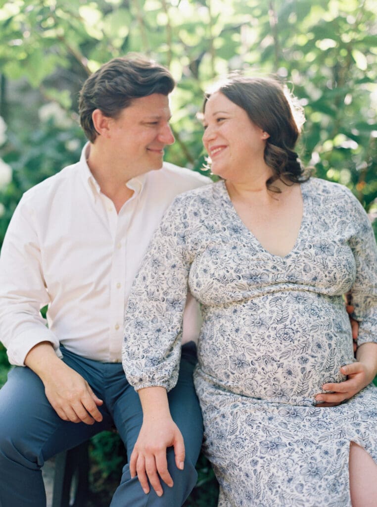 Maternity session at Brookside Gardens — expecting mother walking hand in hand with her husband, captured by luxury maternity & newborn photographer Washington DC area.
