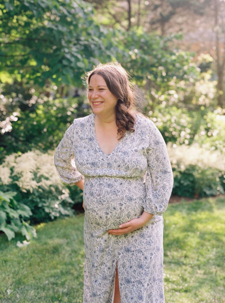 Maternity session at Brookside Gardens — expecting mother walking hand in hand with her husband, captured by luxury maternity & newborn photographer Washington DC area.