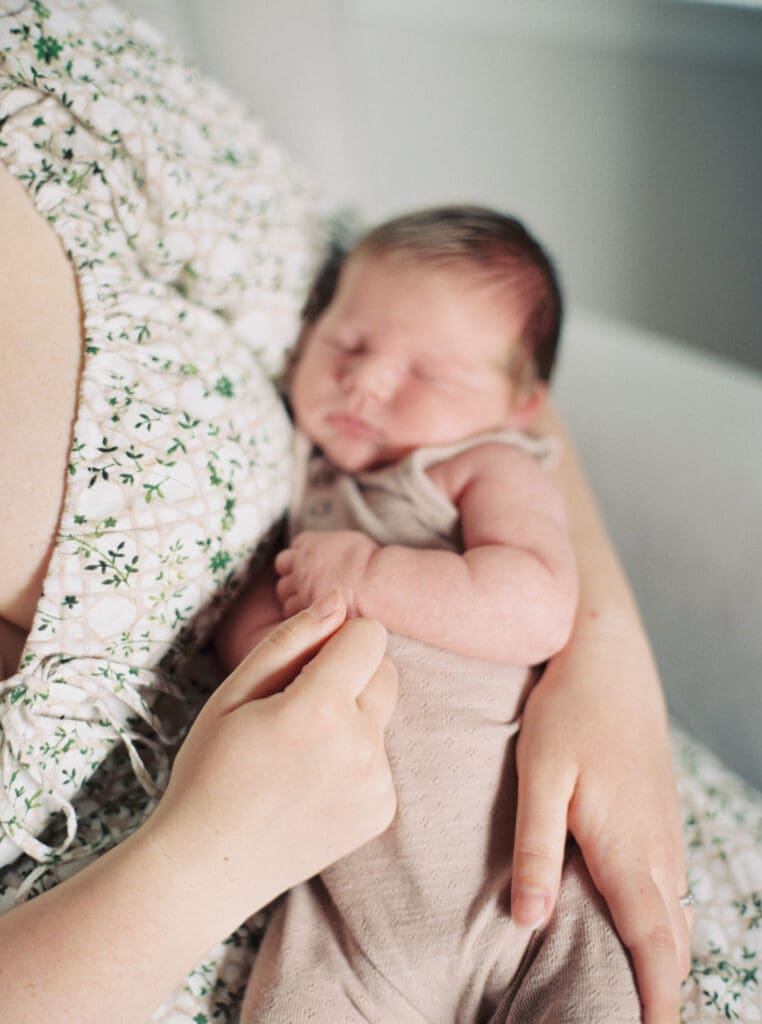 Mother holding her newborn baby boy during an in-home session in Washington DC — intimate lifestyle photos by luxury maternity & newborn photographer Washington DC area