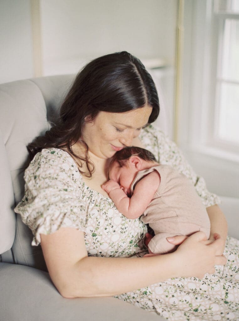 Mother holding her newborn baby boy during an in-home session in Washington DC — intimate lifestyle photos by luxury maternity & newborn photographer Washington DC area