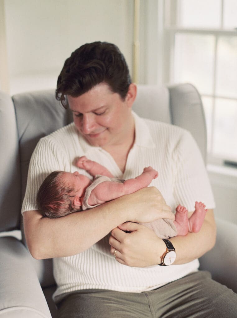 Mother holding her newborn baby boy during an in-home session in Washington DC — intimate lifestyle photos by luxury maternity & newborn photographer Washington DC area