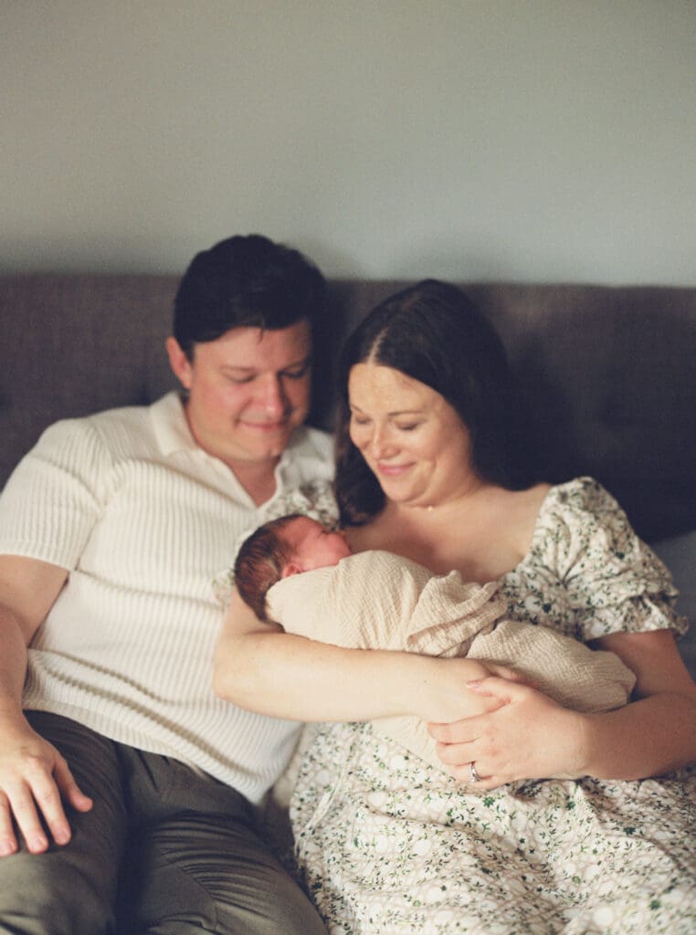 Mother holding her newborn baby boy during an in-home session in Washington DC — intimate lifestyle photos by luxury maternity & newborn photographer Washington DC area