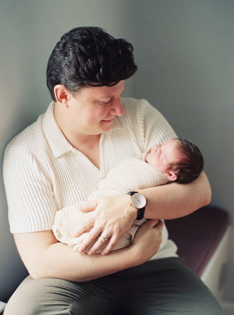 Mother holding her newborn baby boy during an in-home session in Washington DC — intimate lifestyle photos by luxury maternity & newborn photographer Washington DC area